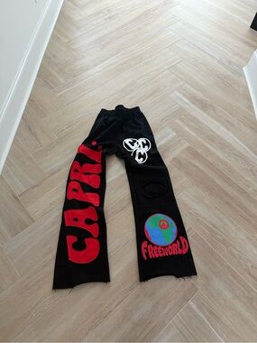 Black Graphic Sweatpants with Red 'CARE' and Freeworld Print